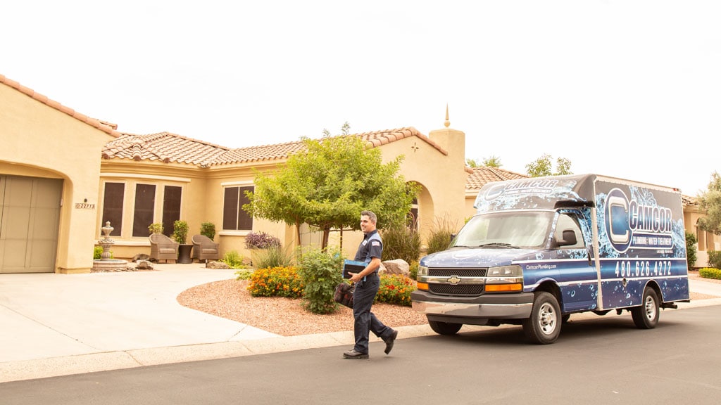 Camcor van in front of house with technician.