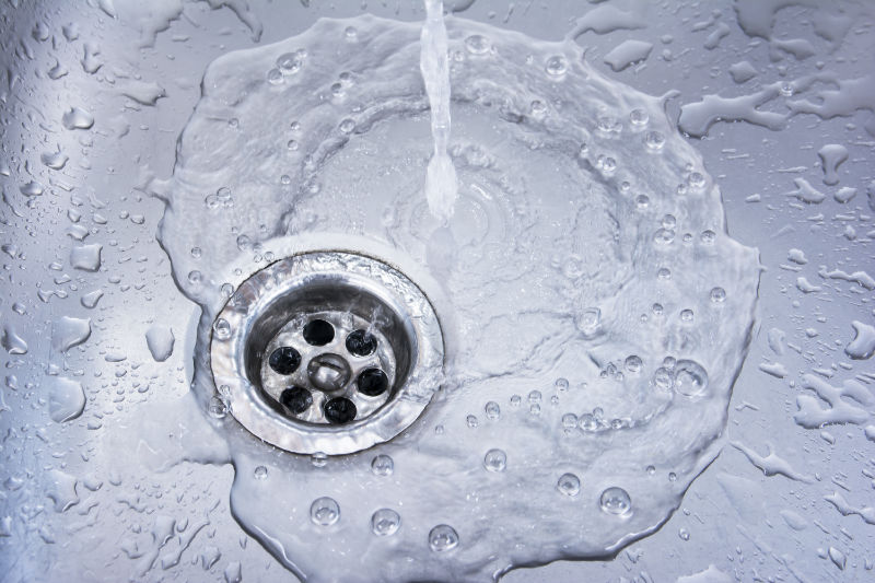 Water running down a drain.